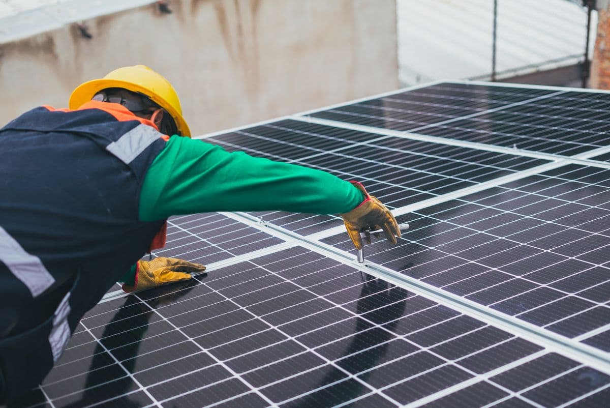 SV Solar technician installing rooftop panels